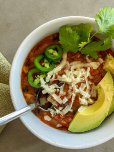 Qdoba Tortilla Soup Recipe with avocado and jalapeno peppers, cilantro, cheese