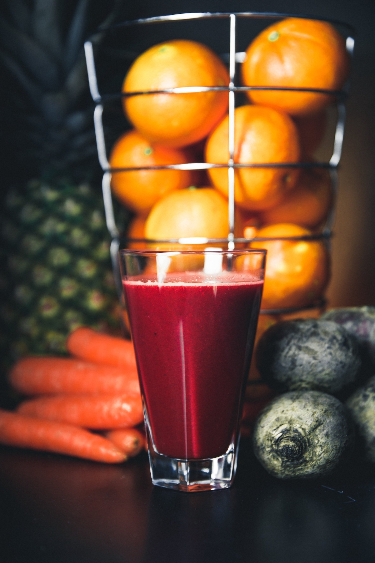 beet juice with carrots and beets in the background, can you freeze fresh juice from the juicer?